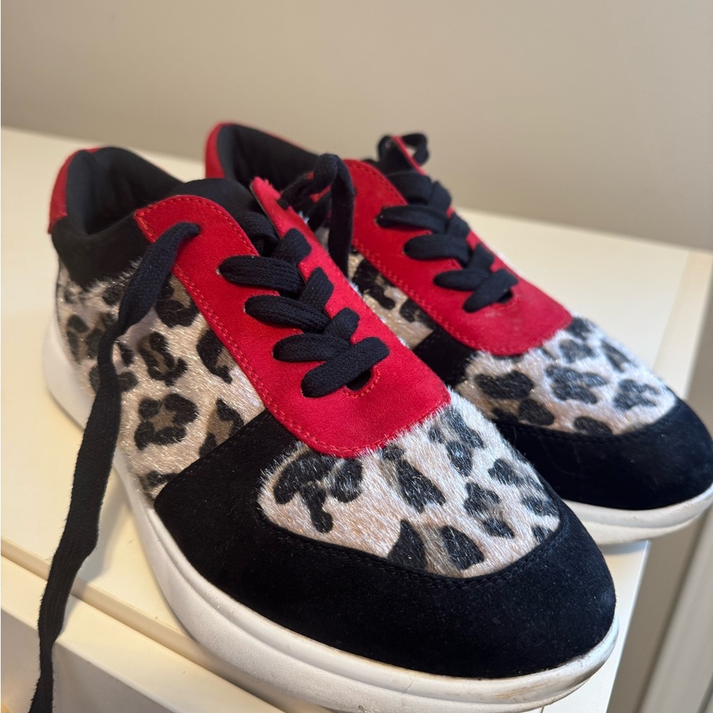 Red and Black Sneakers with Eye-Catching Design